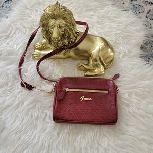 Maroon Guess crossbody purse with gold hardware